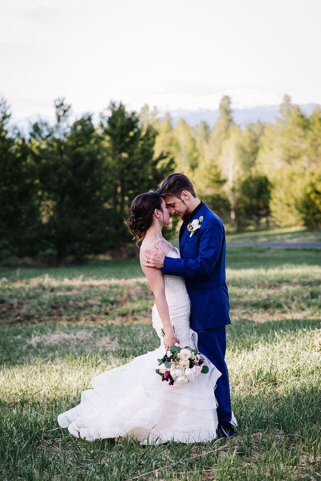 Couple embraces after their wedding ceremony at Moonridge Cabin in McCall, Idaho.