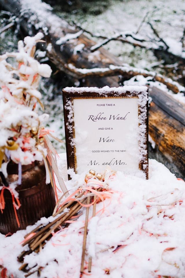 Wedding details covered in snow at a Redfish Lake Lodge Wedding in Stanley, Idaho.