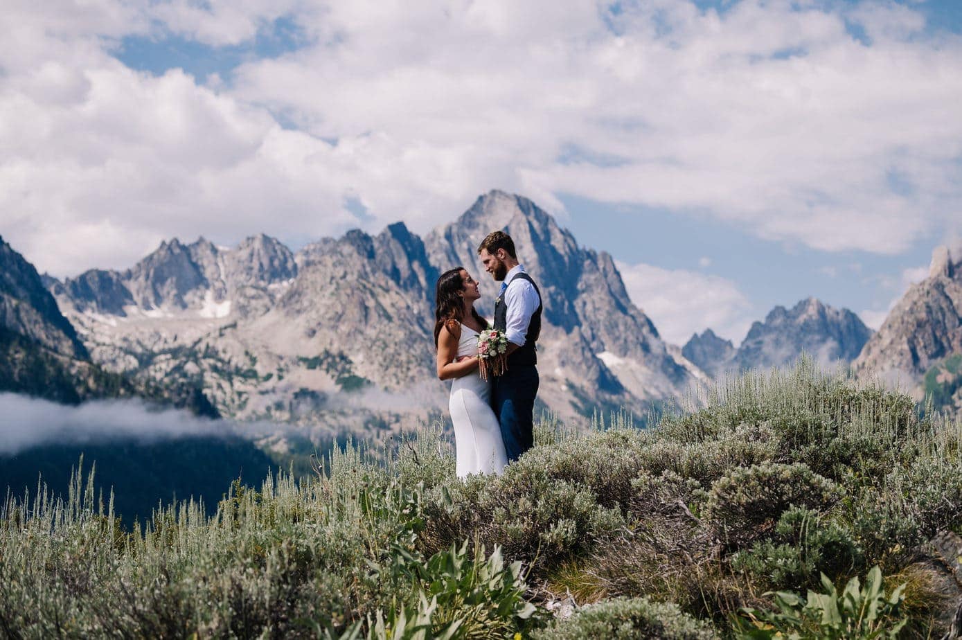 Couple stands together after their sawtooth mountain elopement.