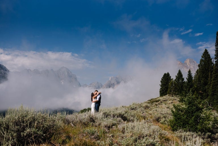 Elopement couple stands together in the mountains after their sawtooth mountain elopement.