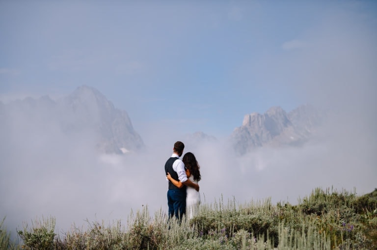 Elopement couple admires the view after their sawtooth mountain elopement.